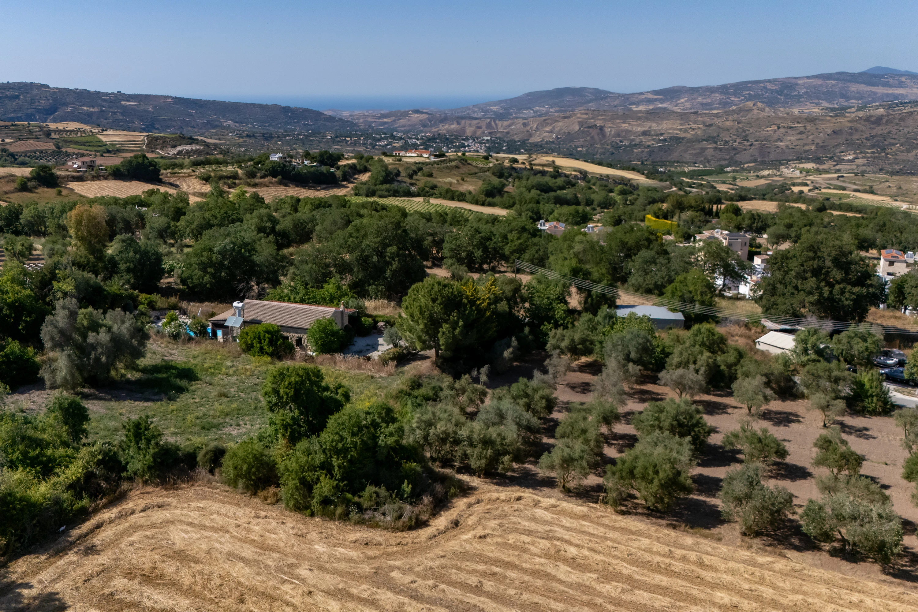 Aerial view of Stroumpi village and surrounding Paphos hills